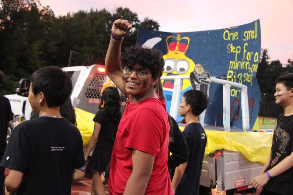 Freshman Med Pappula cheers as he and the rest of the class of 2029 float committee accompanies their float through the parade. The class of 2026, 2027, 2028 and 2029 floats were shown off during halftime at the 2025 homecoming football game on Sept. 26. “After we finished [the float parade], [the class of 2029 float committee] celebrated,” Med said. “We felt special because we built something that [meant a lot to us] and special to our whole grade.”
