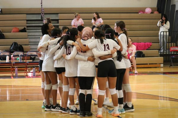 Jefferson girls freshman volleyball team huddles and exchanges strategy before the game. “Collaboration and communication [are] very important in [volleyball],” Li said.