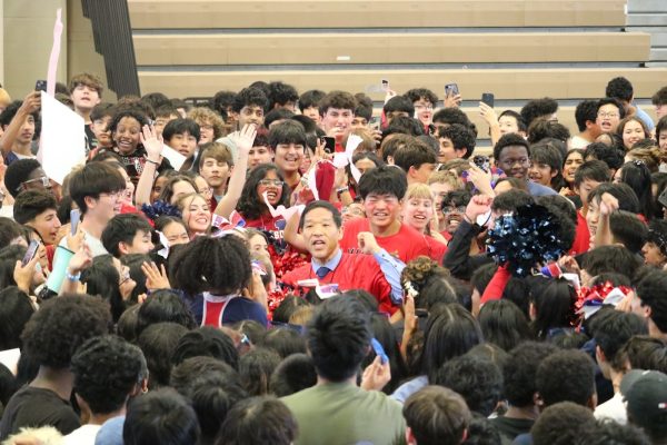Principal Michael Mukai gives a speech at the end of the homecoming pep rally. “It was kind of heartwarming in a way," freshman Kelsey Routman said.