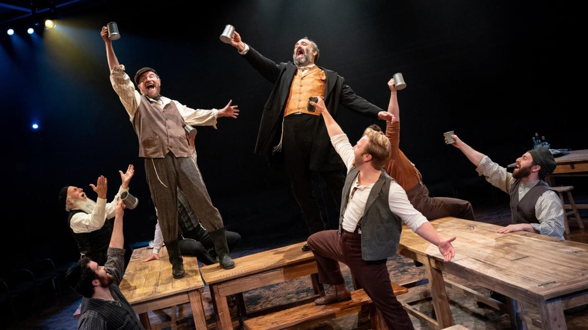 Tevye (Douglas Sills), Lazar Wolf (Jeremy Radin) and the rest of the cast of Fiddler on the Roof perform a celebration in the village inn during the song “To Life.”