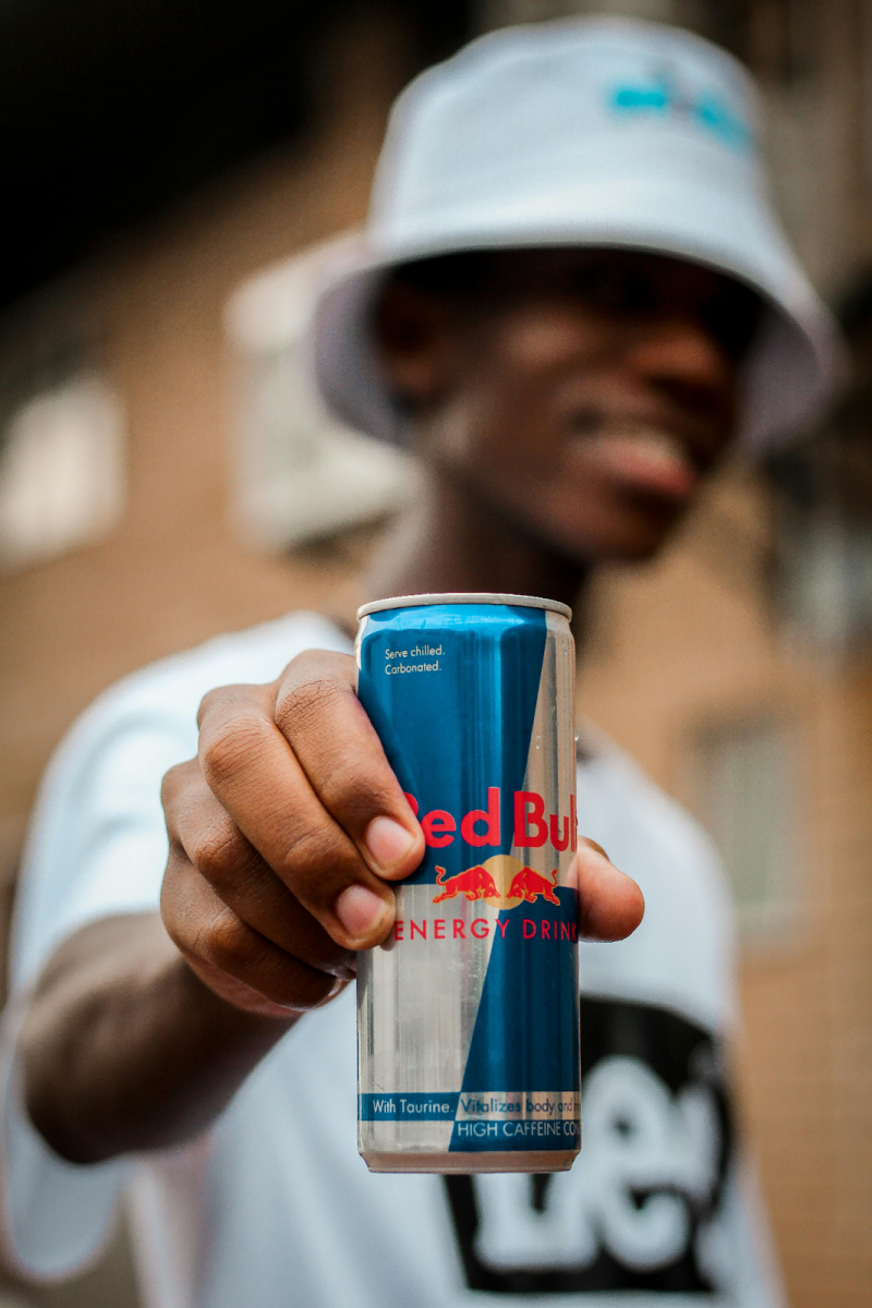 A person holding a Red Bull energy drink. Many students see energy drinks as a helpful tool to get through a day full of school work and after-school activities. In reality, energy drinks are detrimental to both a students’ physical and mental health.