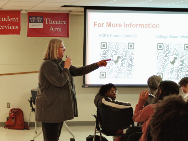Answering questions from students, AP Business Curriculum Fair leader and teacher Ann Craven explains the curriculum of Jefferson's new AP Business course. The course aims to teach students about entrepreneurship, marketing, finance and management together. "There is a school in Virginia Beach that is teaching [AP Business] and I'd love to talk with them,” Craven said. “Whoever's going to teach this course will go to what's called a summer institute, and we'll have a heavy duty, 8 a.m. to 5 p.m., week long training [about] what this course entails and what we can do with it."



