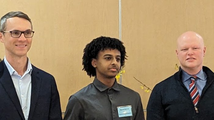 Standing between U.S. Representative James Walkinshaw and School Board Member Ryan McElveen, junior Anwar Kiyar smiles after receiving his award. The Peace Award was given to 28 students including Kiyar, who was recognized forcreating a coding summer camp  and his contributions to Jefferson's Send-A-Smile club. "I wanted to make people feel included, give people the love for coding, and inspire them to do something with their lives," Kiyar said. 