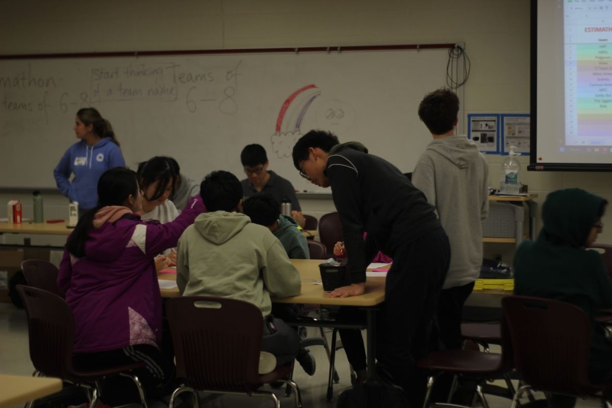 Freshmen Jaejoon Han, Sophie Li, Neil Yerra, Michelle Kim, Sai Lakshminarasimhan, Benjamin Goldstein, Emma Huang and Eva Huang collaborate intensely to work out a Jane Street Estimathon problem. The Jane Street Estimathon is an annual guessing competition that combines teamwork, math, and game theory. “[The Estimathon] this [was] a great experience because it allowed me to think outside of the box,” Li said. “The questions were all really interesting, [ranging from] standard, typical math problems to random guessing questions.”