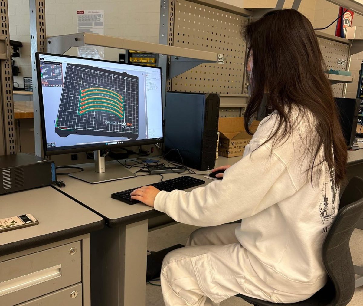 Senior Karis Kim designs a tumbleweed Mars rover for her astronomy lab senior research project. She learns by designing prototypes.