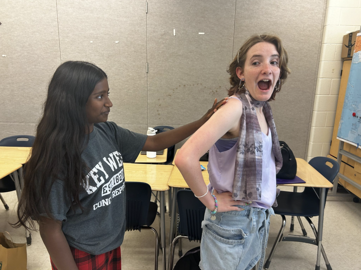 Freshman Athmika Sivaramakrishnan and Nick McGrorey participate in “Sticker Assassins,” tagging each other with stickers. “I think it’s a really sweet idea to get all of us [freshmen] together,” Sivaramakrishnan said.